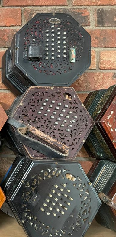 A stack of three concertinas in The Squeezebox Garage