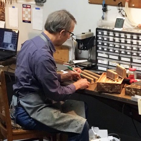 The Squeezebox Garage's Bob Snope repairs an instrument