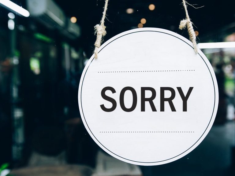 Sign in shop window reads "sorry"